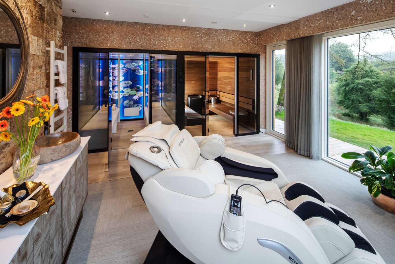 Private spa room at Gilpin Hotel with massage chairs, sauna facilities and views over the gardens.