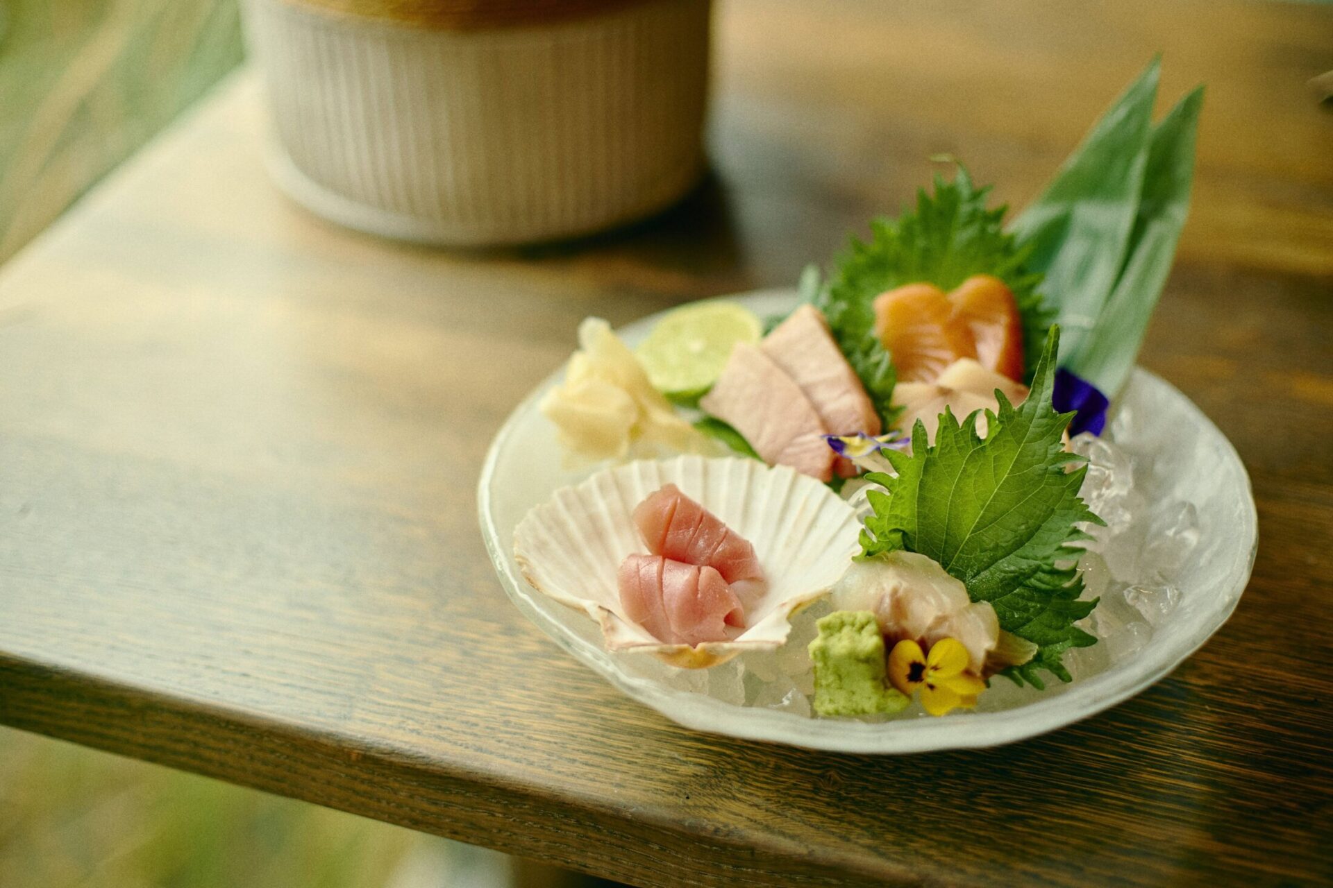 Sashimi dish at Gilpin Spice with assorted sliced fish, wasabi and fresh garnishes.