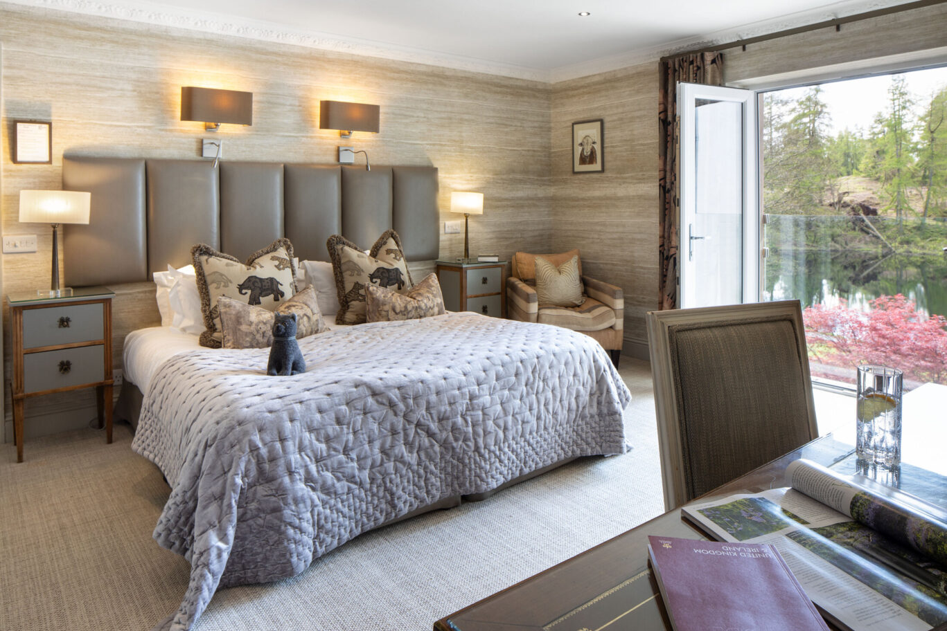 Classic Room at Gilpin Lake House with a king-size bed, soft neutral furnishings and French doors opening onto the garden.