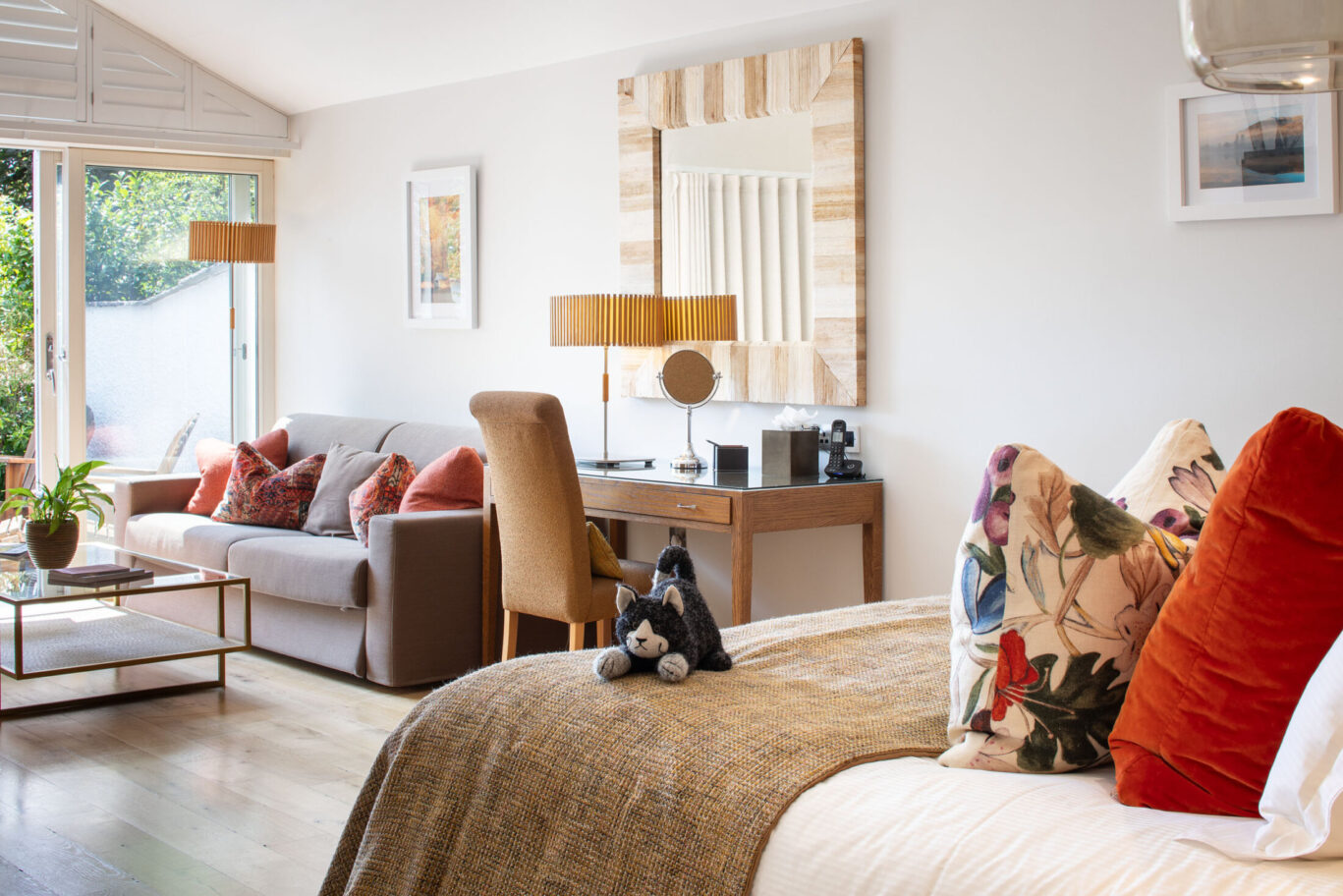 Spacious Crinkle Crags Garden Suite at Gilpin Hotel with a king-size bed, comfortable seating area and private garden access.
