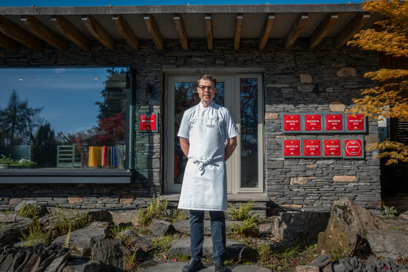 Head Chef Kevin Scanlan standing outside Gilpin Hotel in his chef whites.