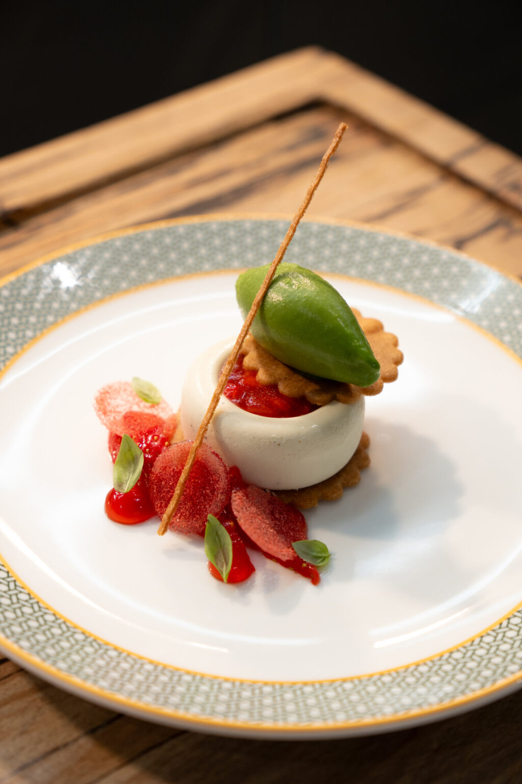 Strawberry dessert at SOURCE, served with a smooth white mousse, fresh strawberries and green sorbet.