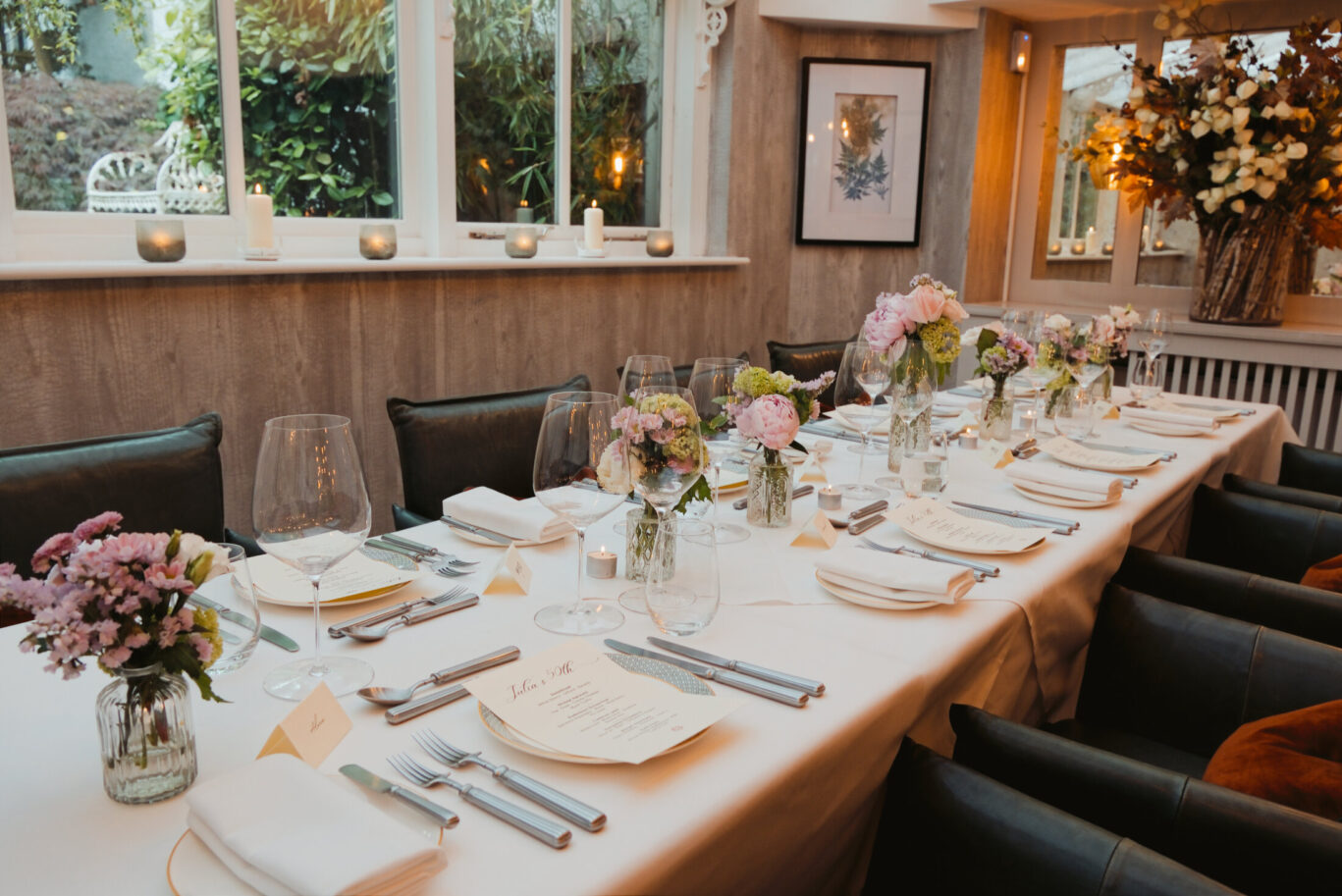 SOURCE Private Dining Room set up with flowers, beautiful decor and set for a private function for 12 people.