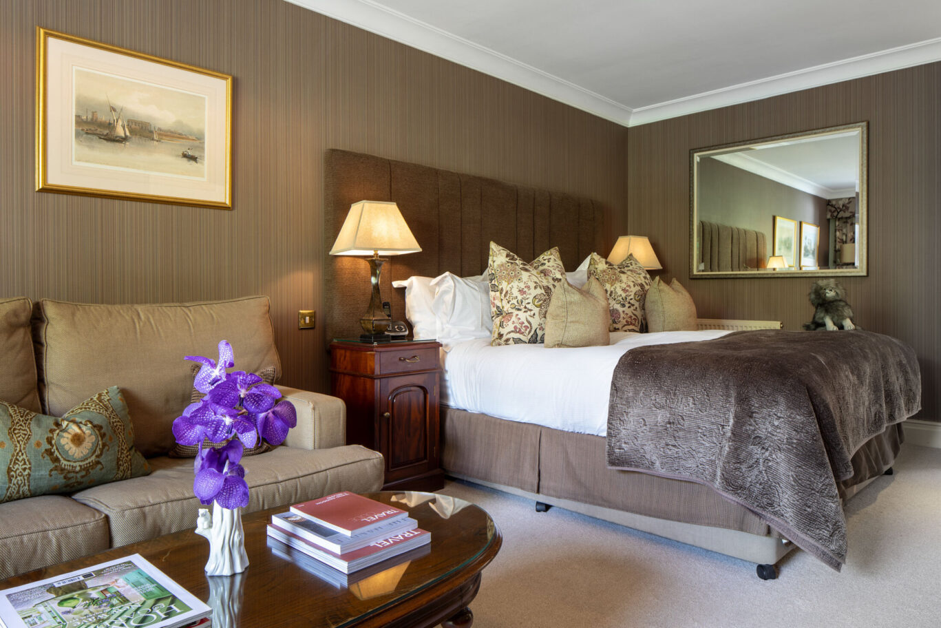 Grasmere Junior Suite at Gilpin Hotel with a king-size bed, comfortable lounge area and warm neutral décor.
