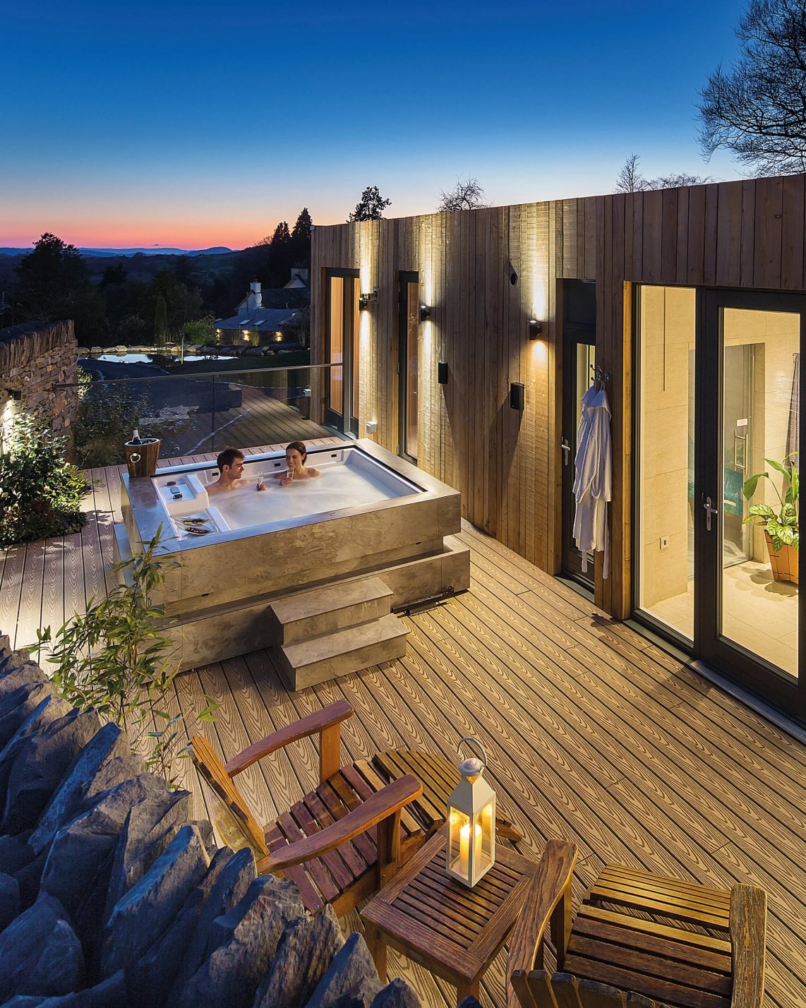 Gilpin Spa Lodge at sunset with a private outdoor hot tub, sauna and secluded wooden terrace.