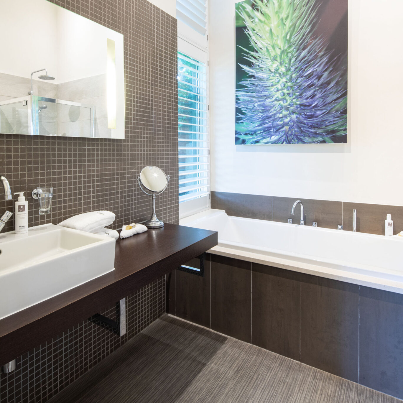 St Sunday Crag Garden Suite bathroom at Gilpin Hotel with a deep bath and contemporary interiors.