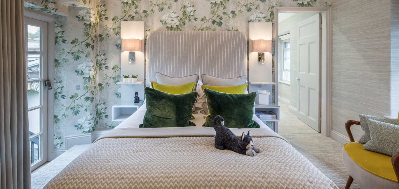 Classic Room at Gilpin Hotel with a king-size bed, floral décor and comfortable seating.