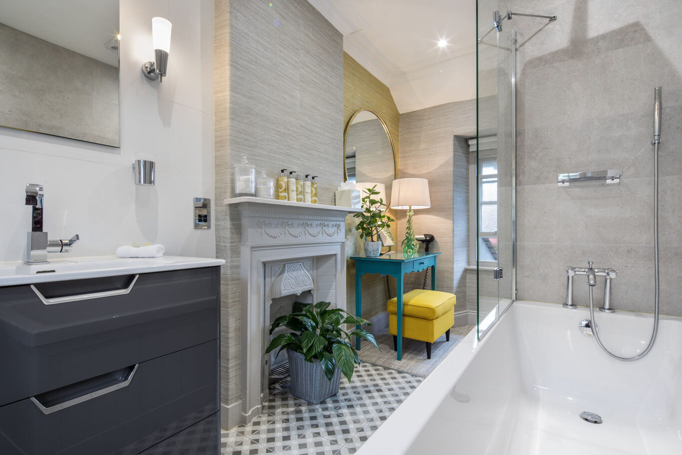 Classic Room bathroom at Gilpin Hotel with a large bath, walk-in shower, contemporary vanity and elegant grey finishes.