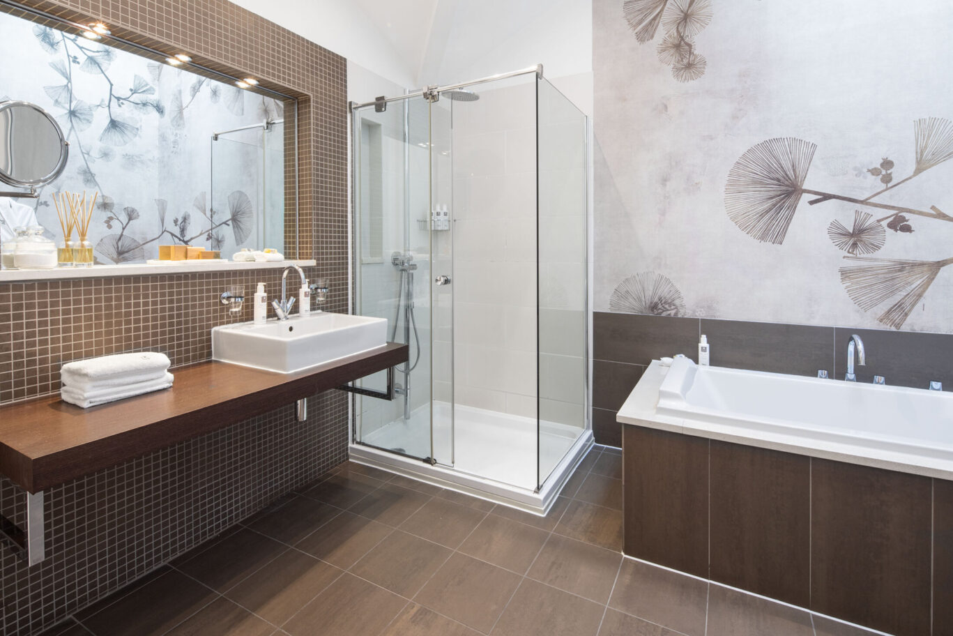 Garden Suite bathroom at Gilpin Hotel with a bath, walk-in shower and botanical wall design.