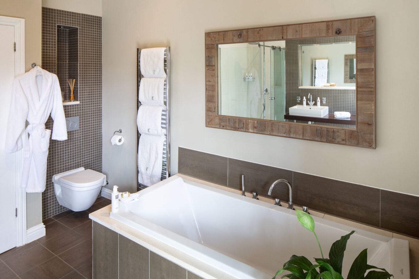 Garden Suite at Gilpin Hotel with a large bath, walk-in shower and contemporary tiled bathroom.