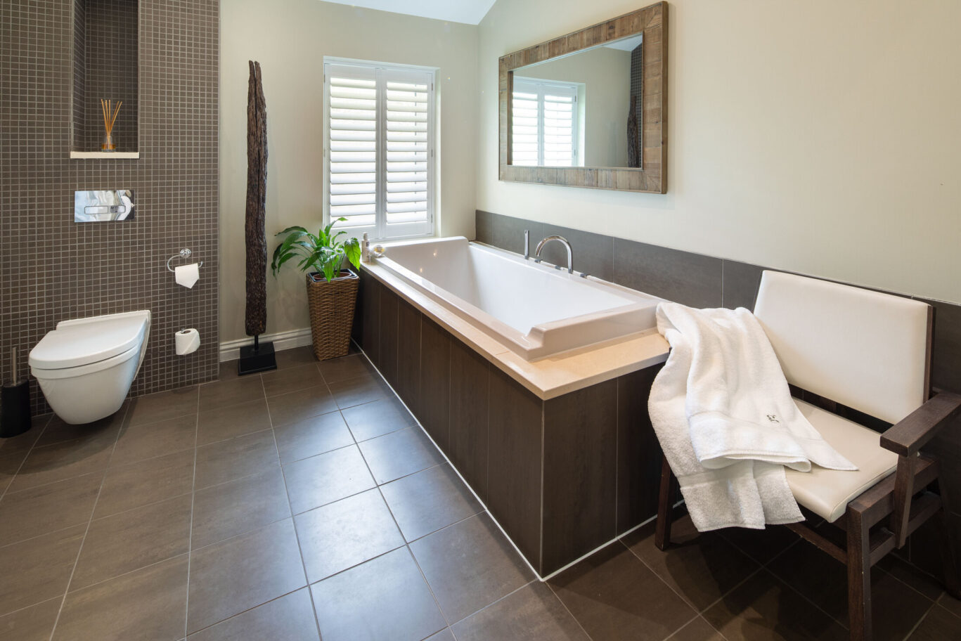 Garden Suite bathroom at Gilpin Hotel with a large bath and contemporary interiors.