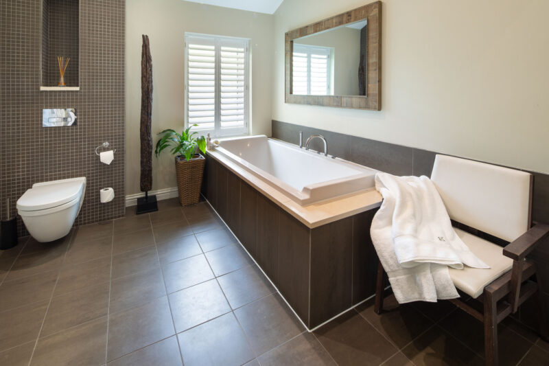 Garden Suite bathroom at Gilpin Hotel with a large bath and contemporary interiors.